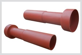 Two red-brown tubular insulation boots for draw-out circuit breaker contacts, each with a flared collar at one end and an open cup mouth at the other.